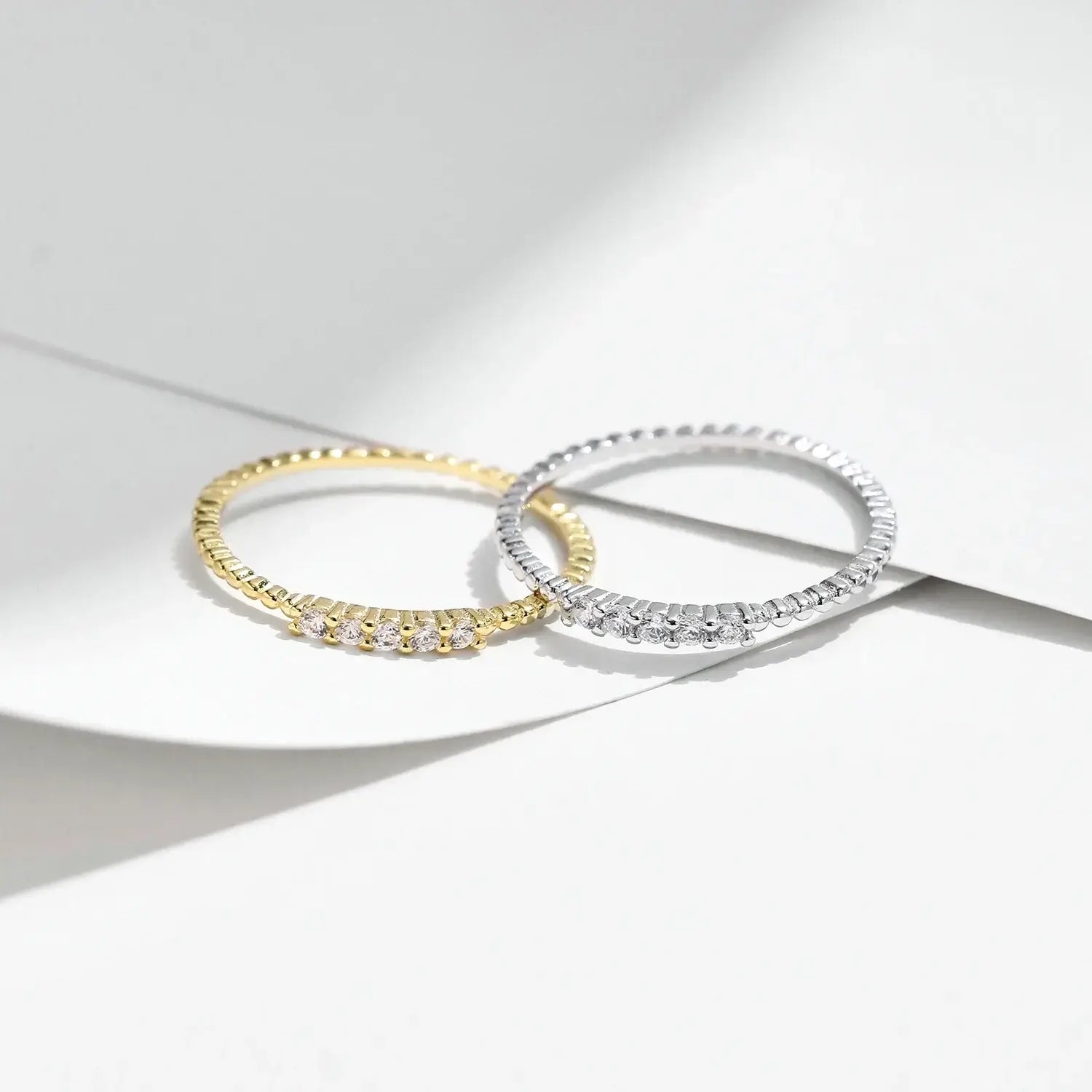 Moissanite Eternity Band Ring in 925 Sterling Silver with elegant design and sparkling stones on a minimalistic background.