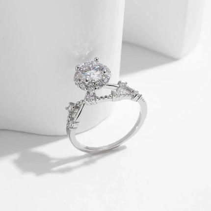 Moissanite Halo Ring with Lab Diamond Accent in sterling silver, featuring round-cut moissanite and intricate design.