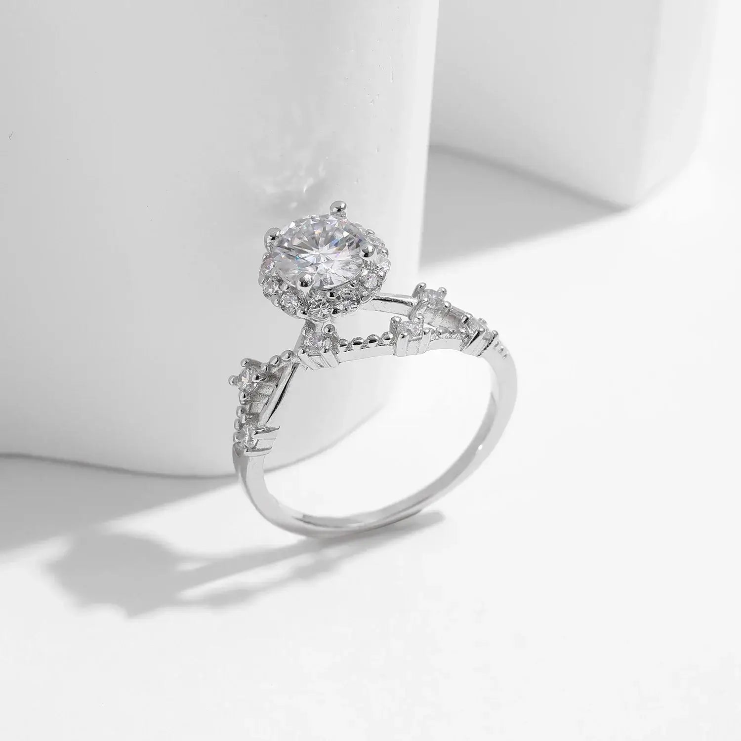Moissanite Halo Ring with Lab Diamond Accent in sterling silver, featuring round-cut moissanite and intricate design.