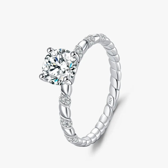 Moissanite Twist Ring in 925 Sterling Silver featuring a round-cut moissanite in a twisted band design.