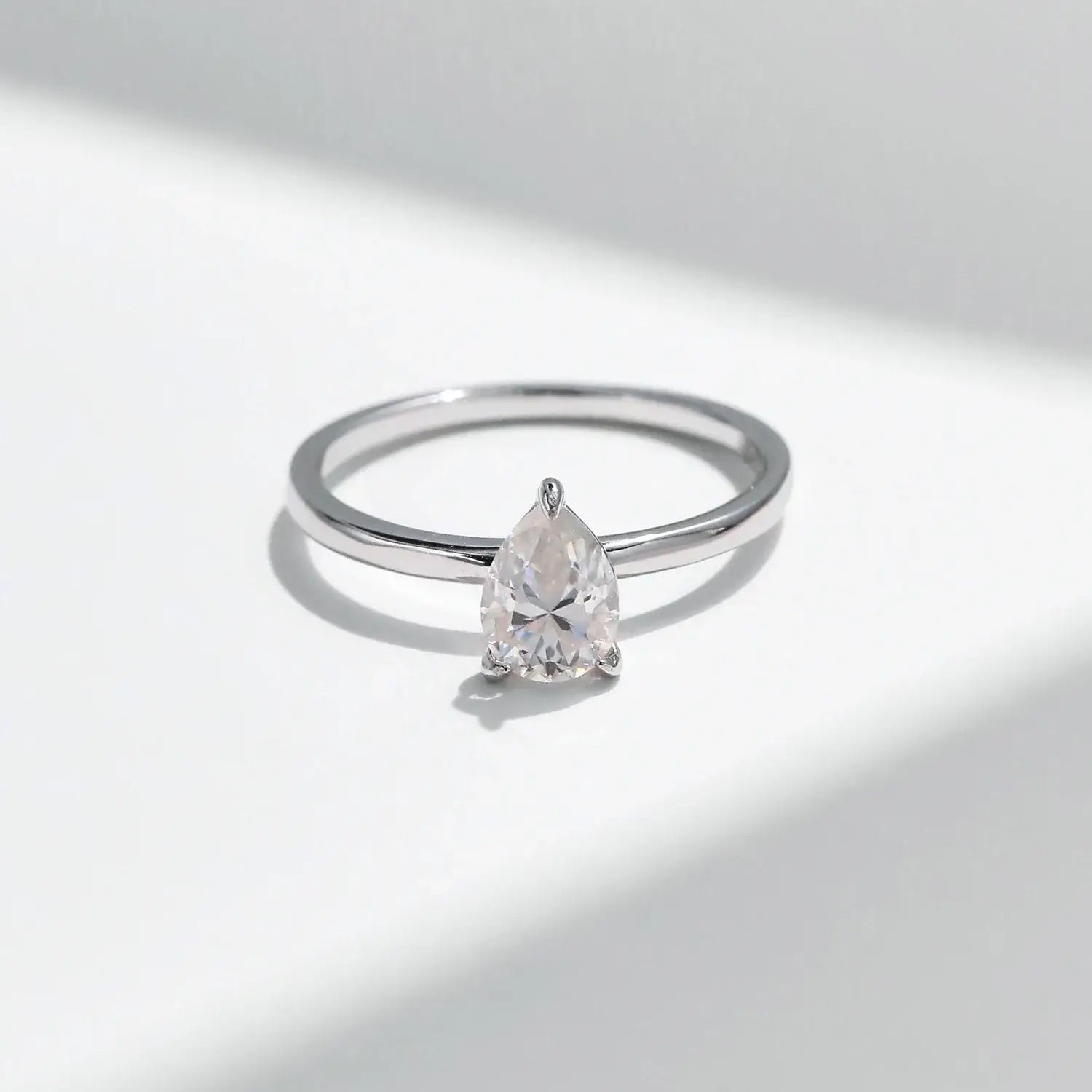 Pear Cut Moissanite Ring 925 Sterling Silver with a water-drop moissanite in prong setting.