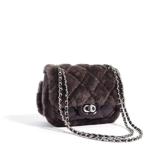 Elegant brown quilted handbag with chain strap, stylish crossbody bag for women, perfect for daily use.