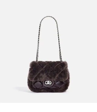 Elegant dark gray faux fur handbag with quilted design and chain strap, perfect for stylish outings.