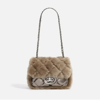 Tan faux fur handbag with chain strap and quilted design, perfect for stylish and elegant wear.