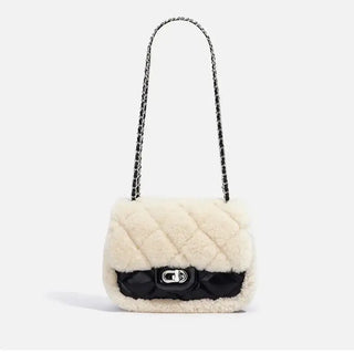 Elegant cream and black quilted handbag, stylish fur shoulder bag for women, perfect for daily use and special occasions.