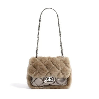 Elegant beige faux fur handbag with silver chain strap, stylish quilted design, perfect for casual outings.