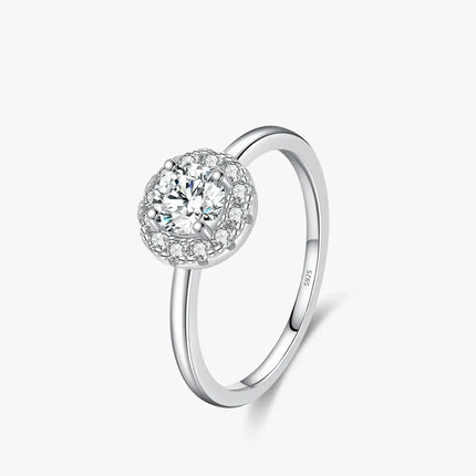 Round Moissanite Ring in 925 Sterling Silver showcasing a round-cut D-color VVS1 moissanite surrounded by cubic zirconia.