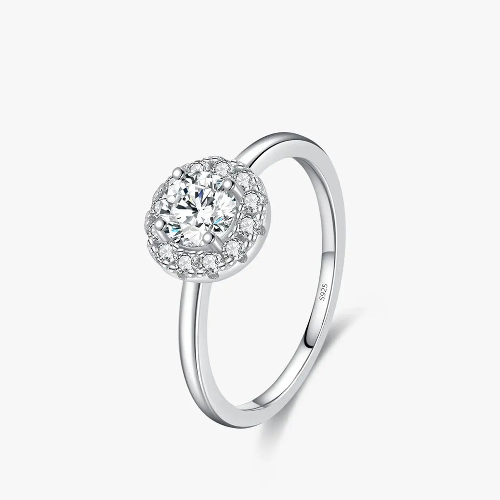 Round Moissanite Ring in 925 Sterling Silver showcasing a round-cut D-color VVS1 moissanite surrounded by cubic zirconia.