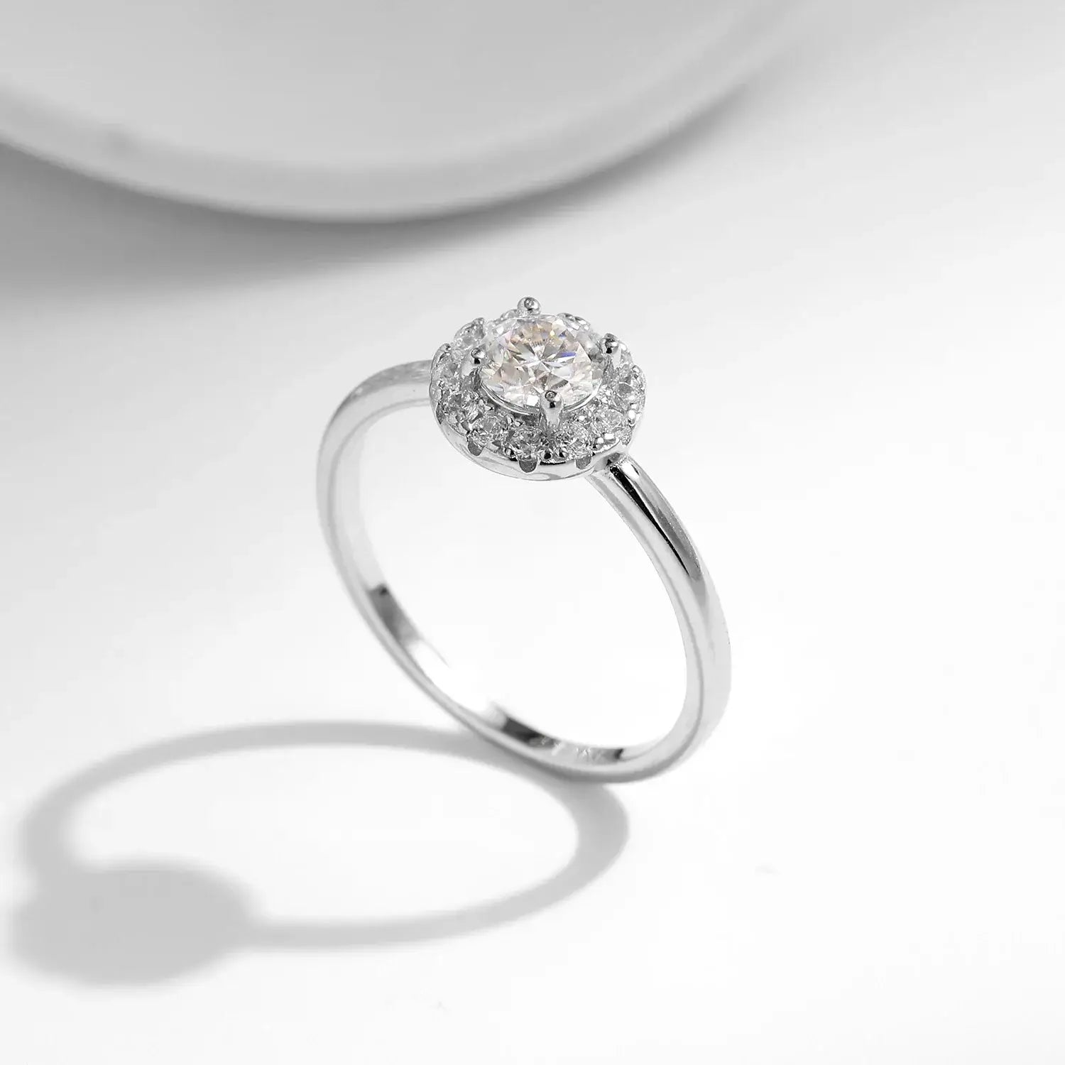 Round Moissanite Ring in 925 Sterling Silver showcasing a stunning round cut moissanite and cubic zirconia side stones.