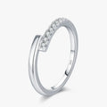 Round Pavé Moissanite Ring in 925 sterling silver with sparkly pavé setting featuring multiple D-color VVS1 stones.