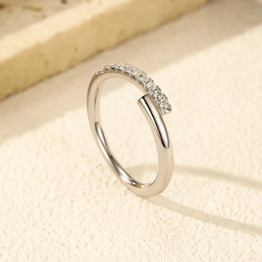 Round Pavé Moissanite Ring featuring D-color VVS1 stones in a pavé setting on a 925 sterling silver band.