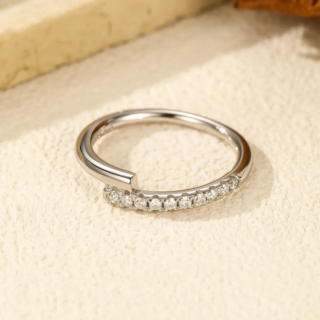 Round Pavé Moissanite Ring showcasing multiple D-color VVS1 stones in a sleek pavé setting.