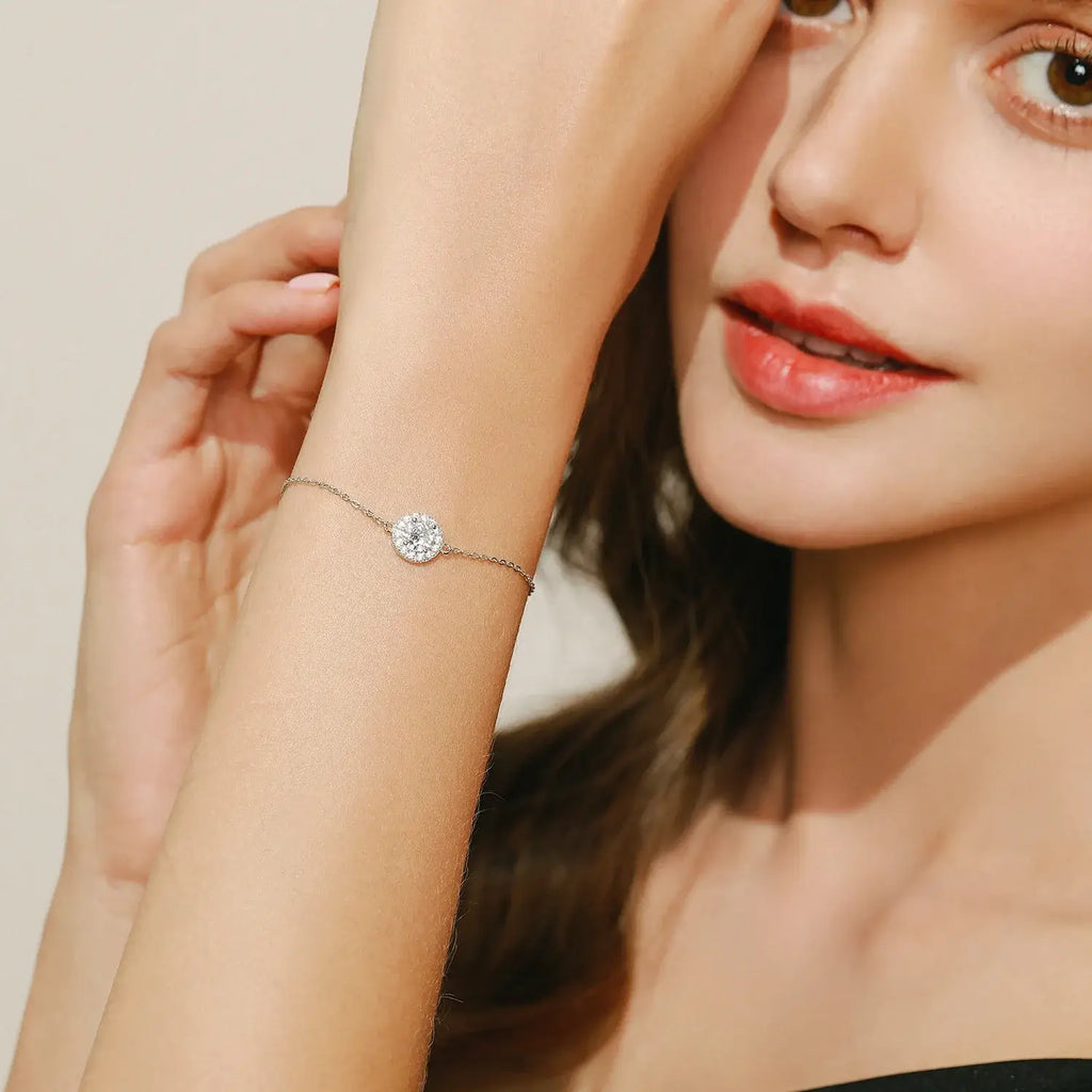 Model showcasing a Round Zircon Charm Bracelet 925 Sterling Silver with sparkling zircon stone.
