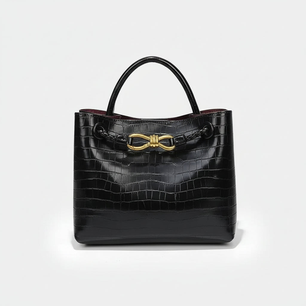 Women's Handbag black crocodile pattern tote with gold hardware and soft construction.