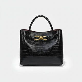 Women's Handbag black crocodile pattern tote with gold hardware and soft construction.