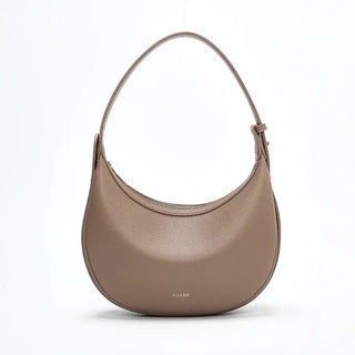 Half Moon Bag with Minimalist Design in soft brown color, featuring a zipper closure and single shoulder strap.