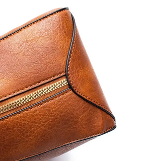 Hobo shoulder bag wallet pouch close-up detail of zipper and high-quality tan PU leather.