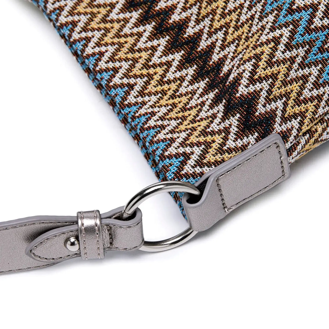 Women's shoulder bag multicolor zigzag pattern in brown and blue with silver hardware detail close-up.