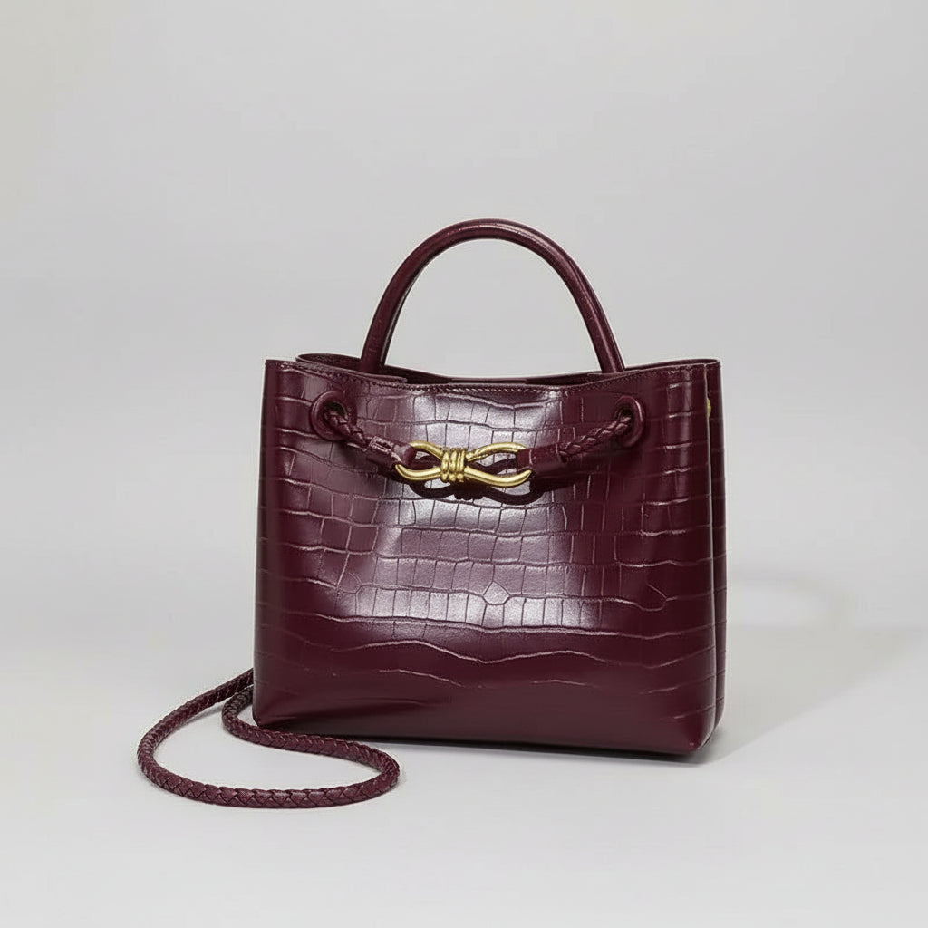 Women's Handbag Stone Pattern Tote Bag in burgundy with bow detail and shoulder strap.