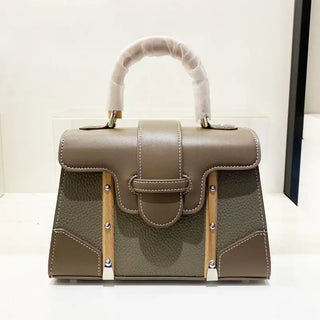 Handbag with wooden handle and rivet decoration perfect for women, showcasing a stylish and hard design in a beige color.