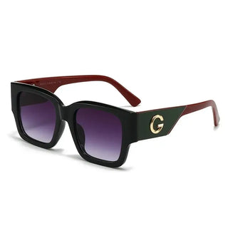Trendy sunglasses with a bold black and burgundy design featuring a gold G emblem, perfect for casual wear.