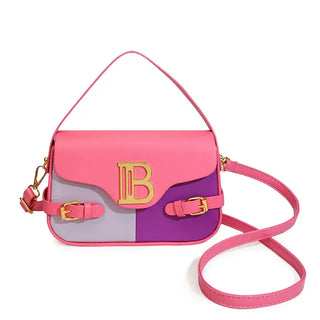 Womens crossbody bag with color-blocking design in pink, purple, and gray, featuring an adjustable strap and gold buckle.