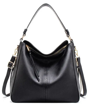 Hobo shoulder bag in black PU leather with slouchy silhouette and gold-tone hardware.