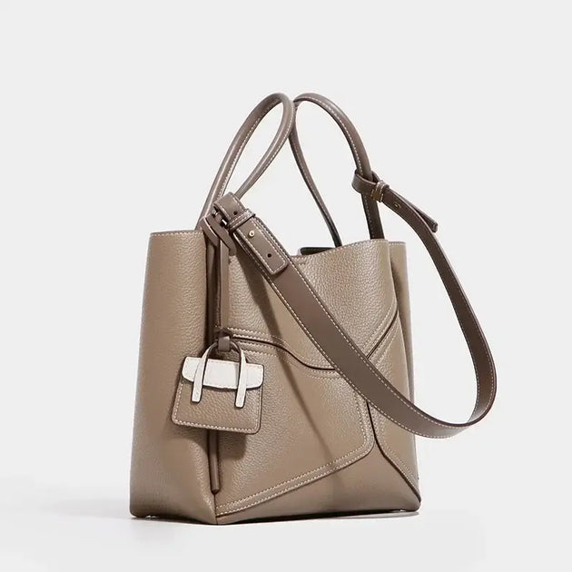Genuine Leather Tote Bag With Zipper Pocket in soft beige color and stylish design.