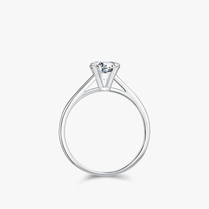 Round Moissanite Ring in 925 Sterling Silver with a classic round-cut stone in prong setting.