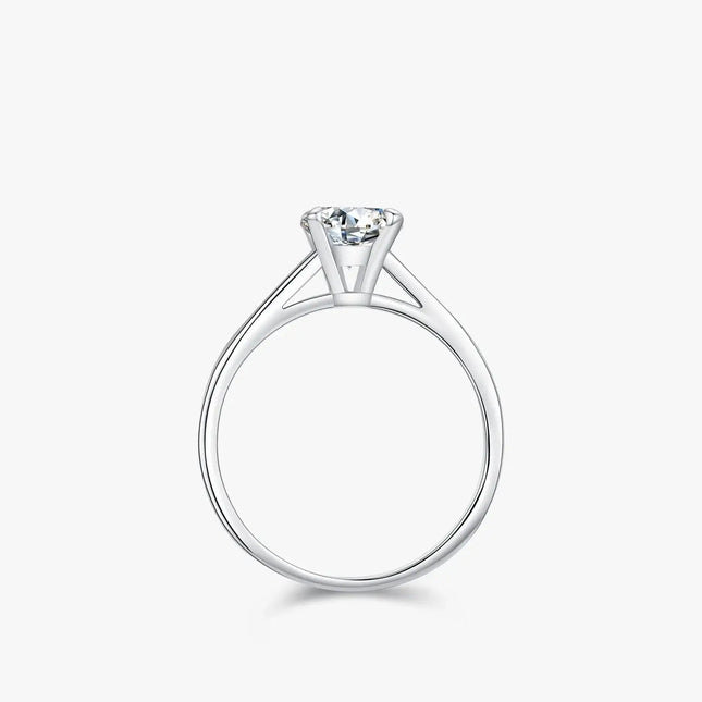 Round Moissanite Ring in 925 Sterling Silver with a classic round-cut stone in prong setting.
