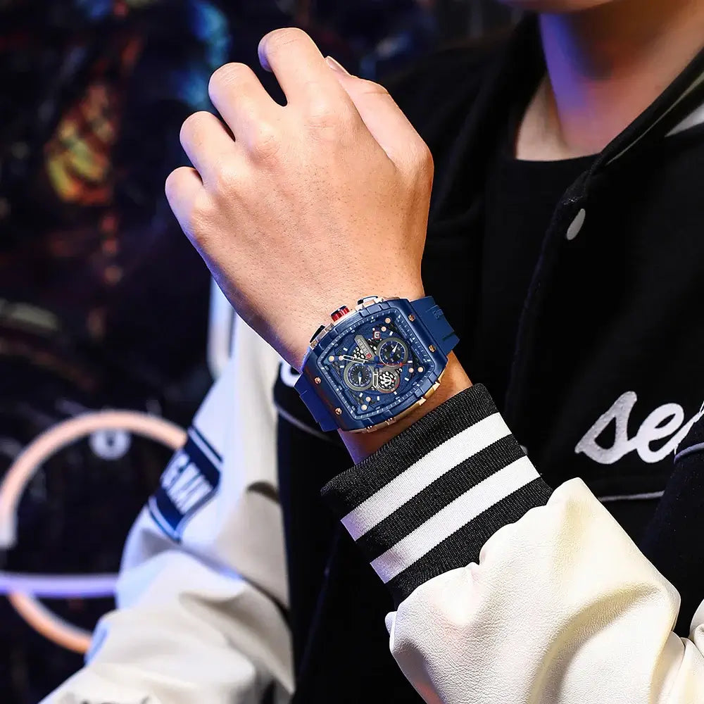 Person wearing blue Sports Watches Unique Rectangular on wrist with sporty outfit in urban setting.