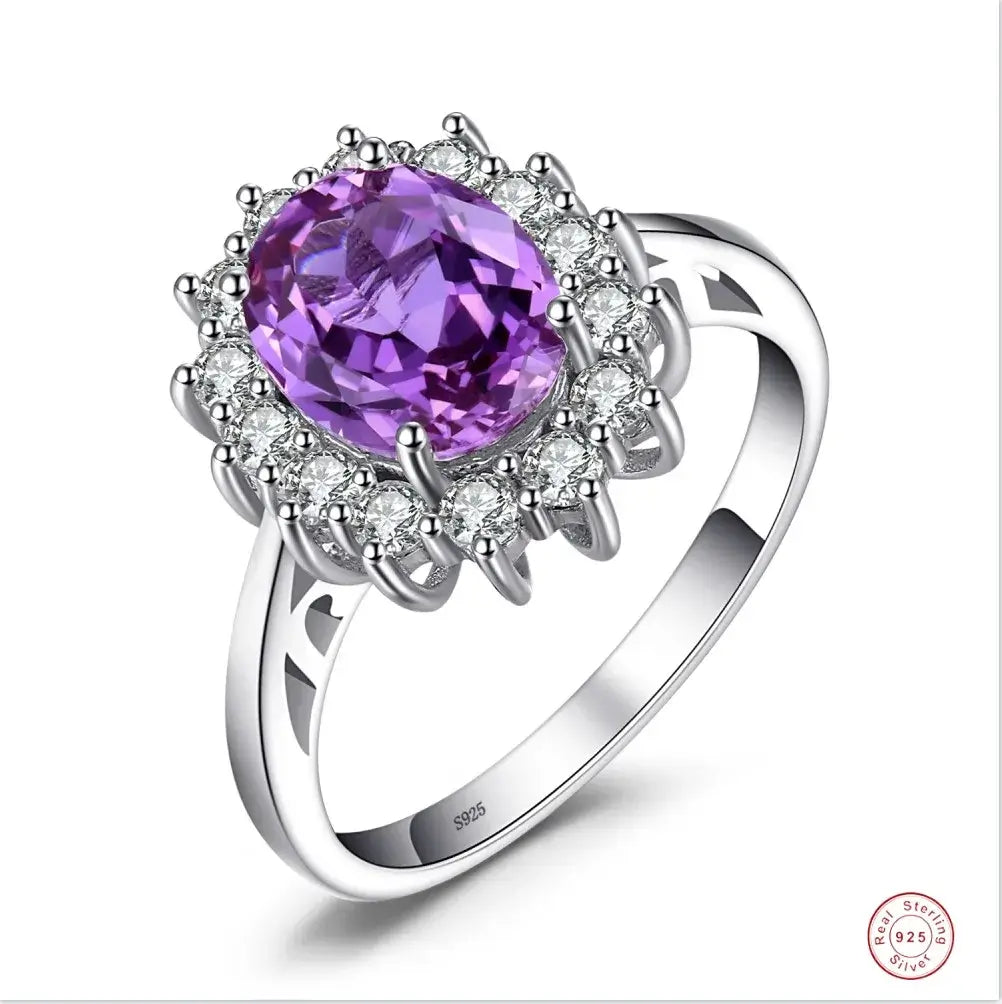 Rings with oval purple gemstone surrounded by sparkling crystals, crafted in sterling silver for women.