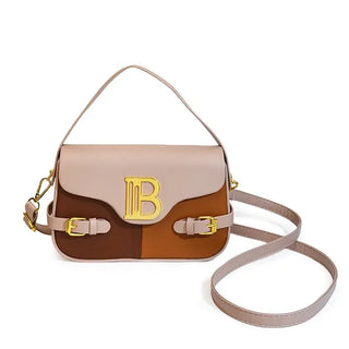 Womens crossbody bag with color-blocking and stitching, featuring a gold logo and an adjustable strap.