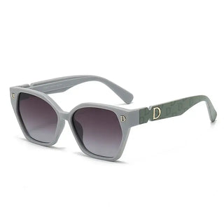 Women's sunglasses with black frames trending in gray design and gradient lenses.
