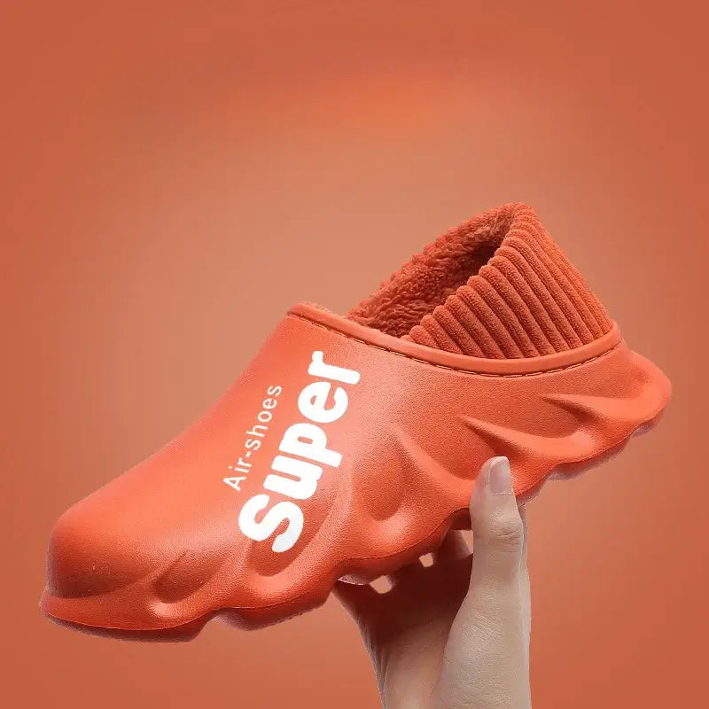 Winter Slippers Warm Unisex Shoes Waterproof in orange with cozy lining and pull-on design.