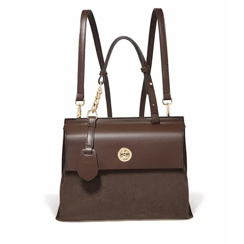 Leather Backpack PVC in brown with a flap and double straps, featuring a gold-colored closure.