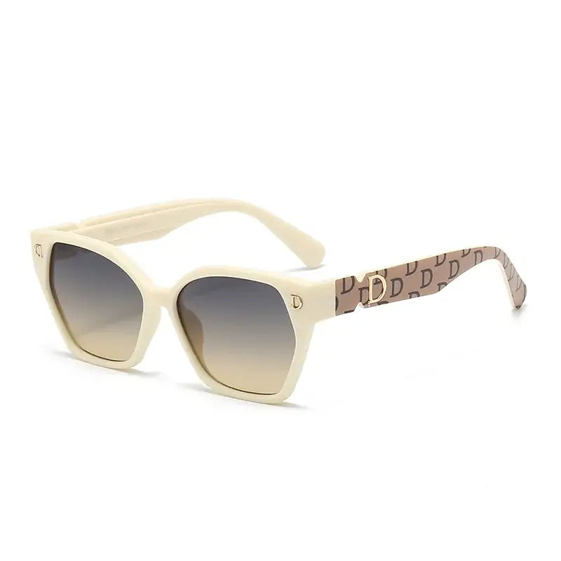 Stylish women's sunglasses with cream-colored frames and gradient lenses.