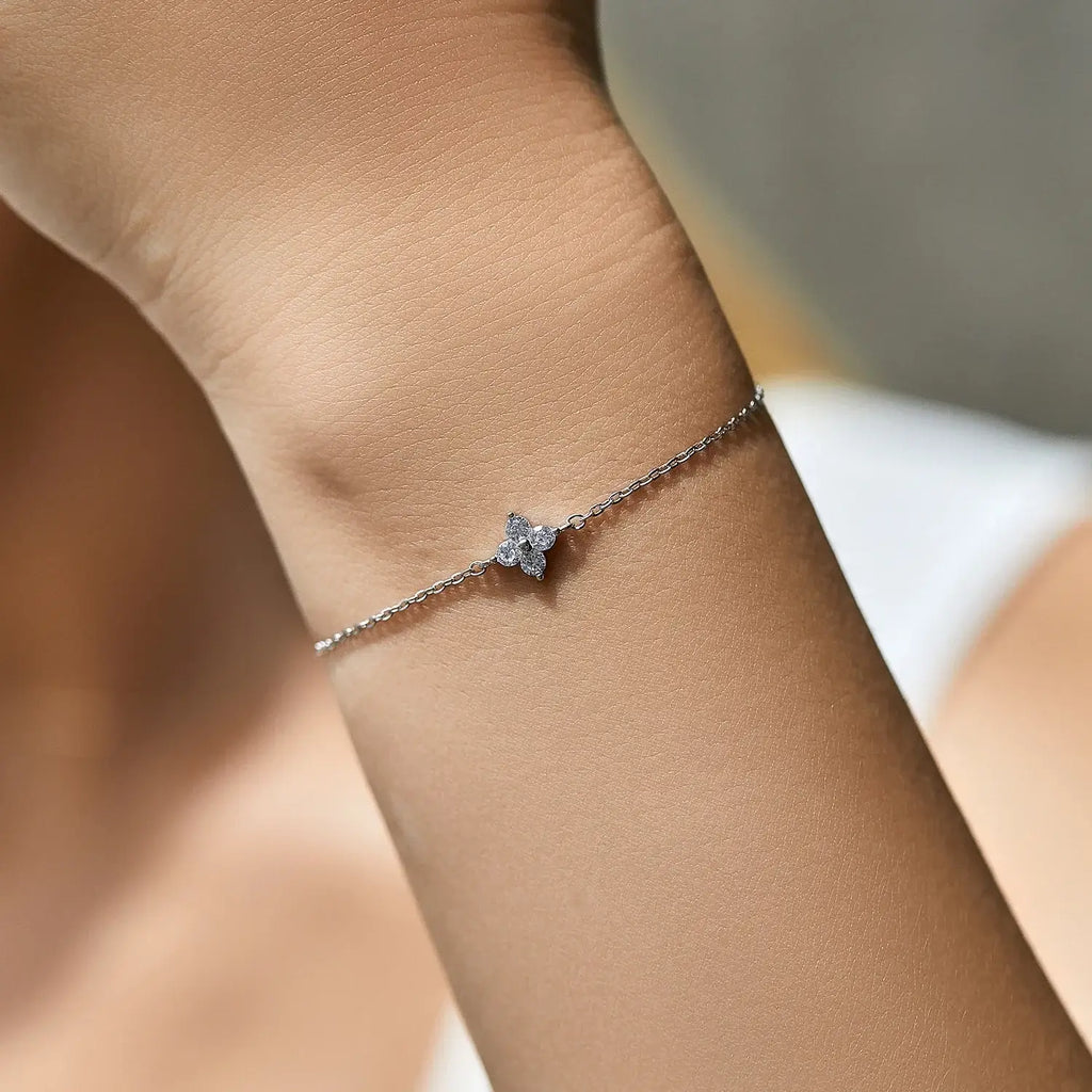 Bracelet 925 Sterling Silver with four leaf clover and cubic zirconia on a wrist.