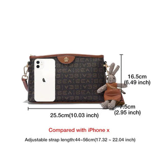 Monogram Crossbody Bag with Cute Bunny Charm displayed alongside an iPhone, highlighting size and adjustable strap.