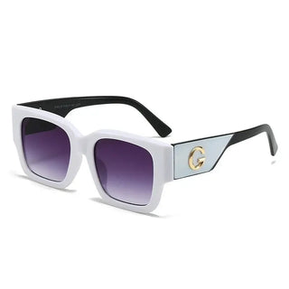 Sunglasses featuring a stylish gold G emblem and trendy square design with gradient lenses for casual wear.