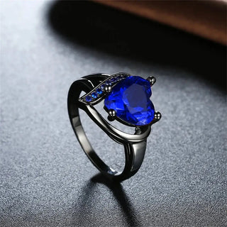 Fashion Couple Rings Stainless Steel with heart-shaped blue gemstone and sleek design.