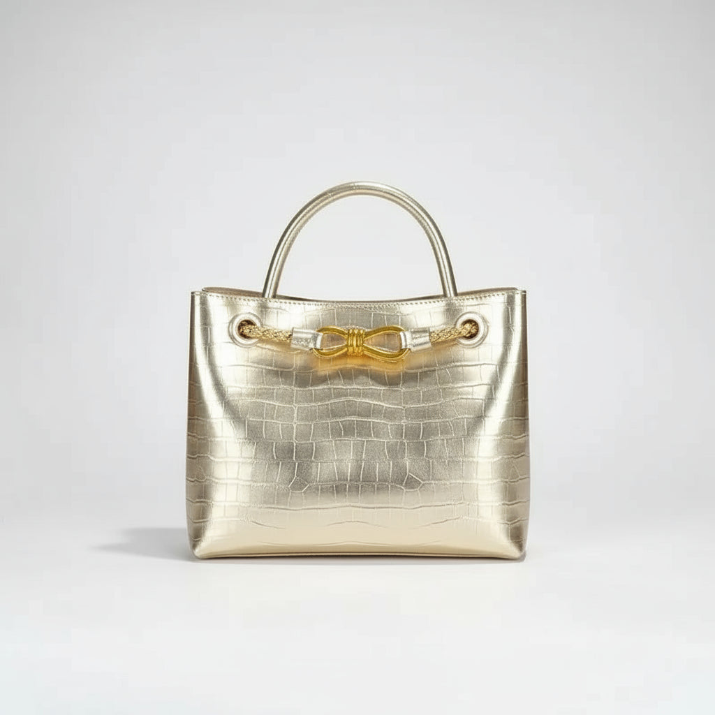 Stylish Women's Handbag in metallic gold with crocodile pattern and elegant gold accents.