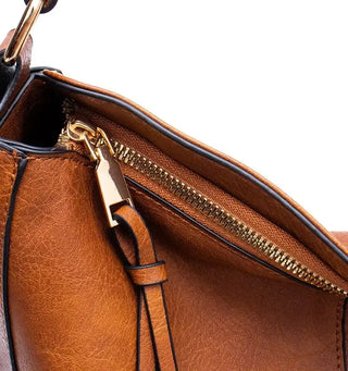 Hobo shoulder bag showing high-quality PU leather and gold-tone zip closure detail.