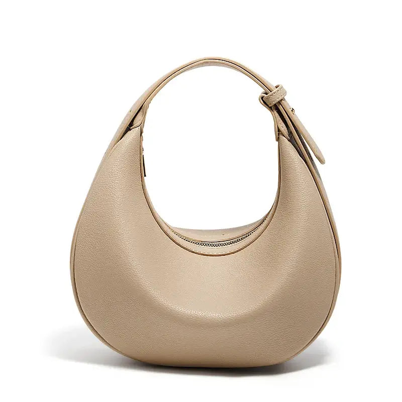 Half Moon Bag with Minimalist Design in beige with a soft structure and single shoulder strap.