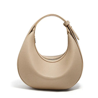 Half Moon Bag with Minimalist Design in beige with a soft structure and single shoulder strap.