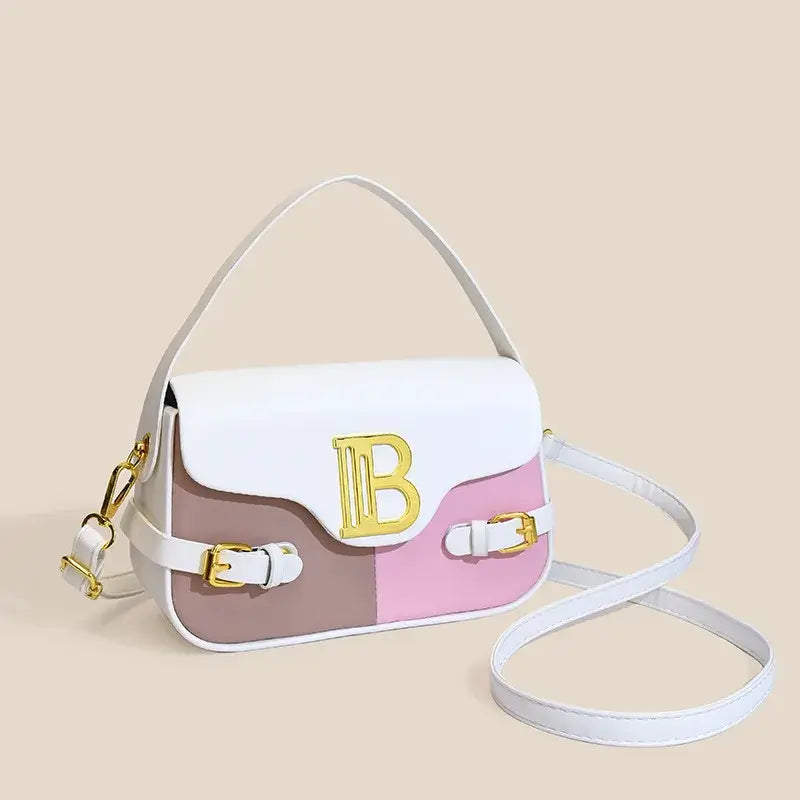 Womens crossbody bag with color-blocking design, featuring pink and white colors and gold detailing.