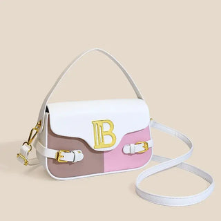 Womens crossbody bag with color-blocking design, featuring pink and white colors and gold detailing.