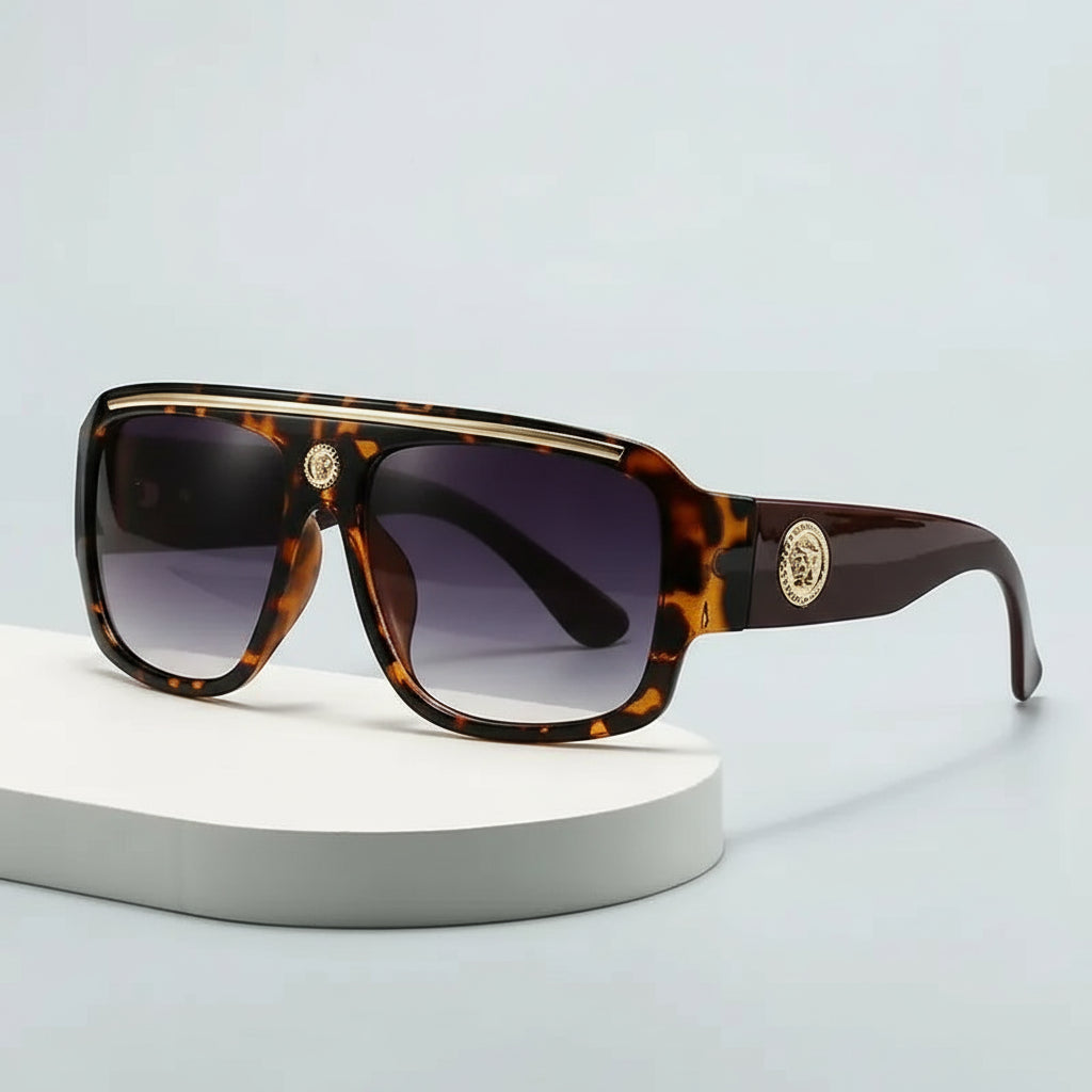 Sunglasses with gold detailing and tortoiseshell frame, perfect for casual adult use.