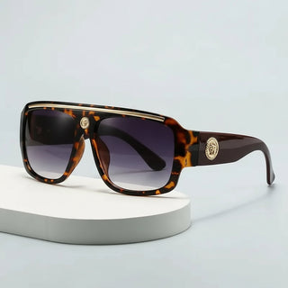 Sunglasses with gold detailing and tortoiseshell frame, perfect for casual adult use.
