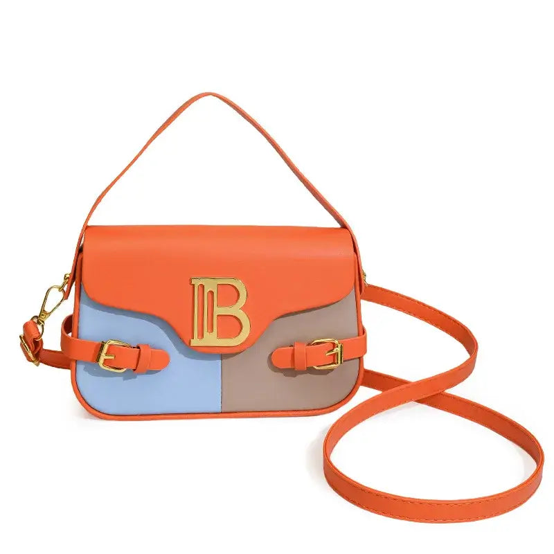 Womens crossbody bag with color-blocking and stitching in orange, blue, and brown with adjustable strap.